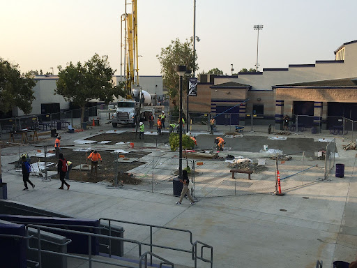 Construction crews pour concrete in the RCHS quad to prepare the site for shade structures. 