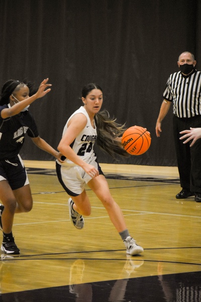 Senior point guard Valerie Rodriguez drives to the basket. 
