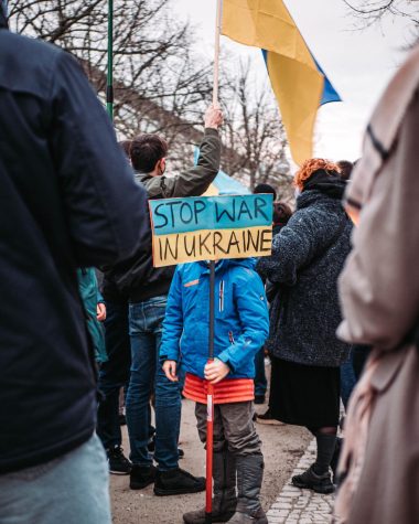 A kid in Berlin, Germany holds up a sign in protest of the war in Ukraine.