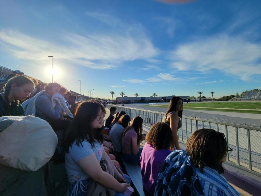Seniors flock to the bleachers to watch performances from cheer, dance, and other peers during Senior Sunrise.