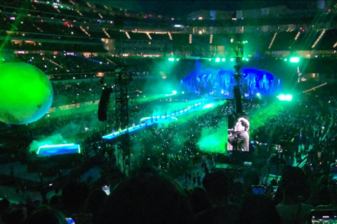 Green lights beam across Sofi Stadium as The Weeknd performs “Gasoline” from his album, Dawn FM. 