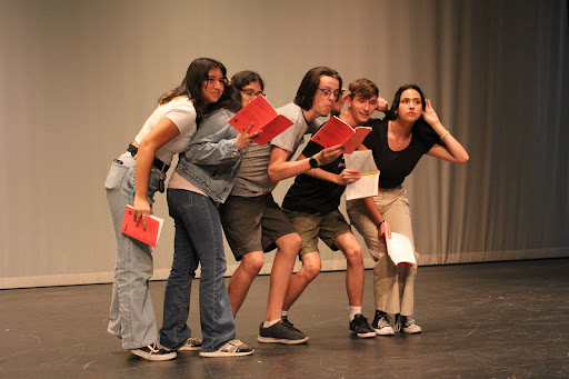 Cast members of Clue rehearse for their upcoming performance.