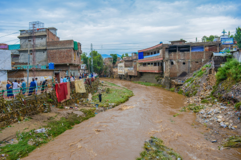 A river overflows, spilling gallons of contaminated water in the surrounding village. Photo used with permission from Pixabay.com