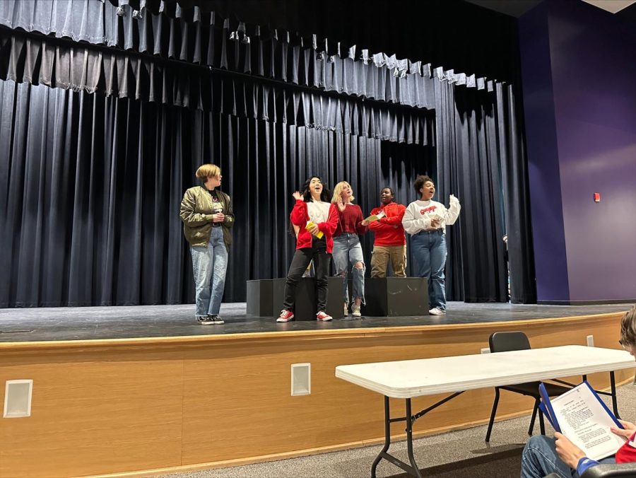 On stage performing, advanced drama students rehearse for the upcoming Inland Invitational.