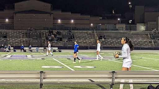 A member of the RCHS girls varsity soccer team gets ready to throw the ball back into play in a game against Serrano on Dec. 14.