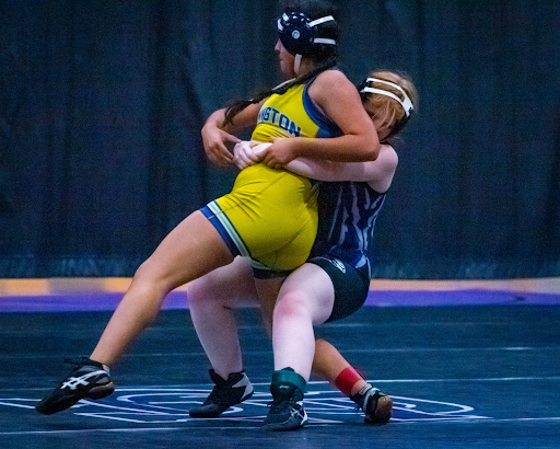 RCHS wrestler slams BHS wrestler down during an intense wrestling match.