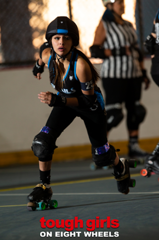 Mini-Tac playing for Jr. Foxtails Roller Derby, she is a jammer and just skated out of the pack. 
