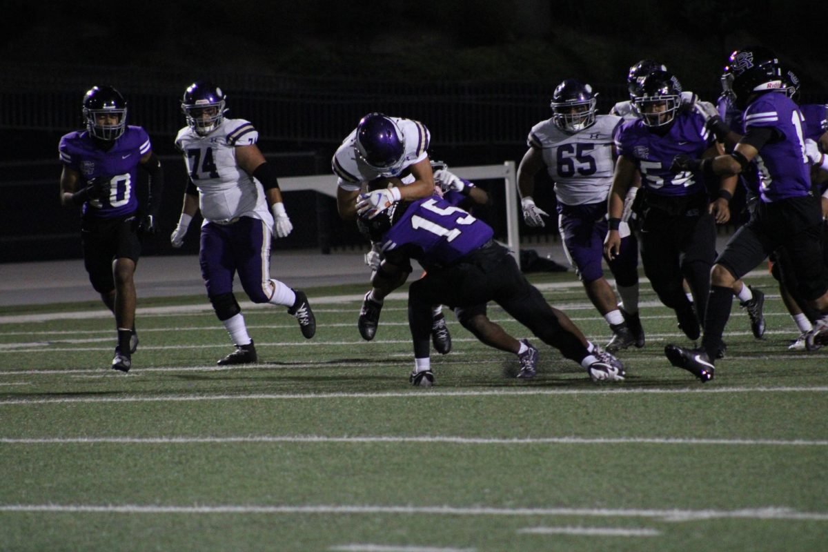 Senior free safety Rahim Wright makes tackles a Vikings player.