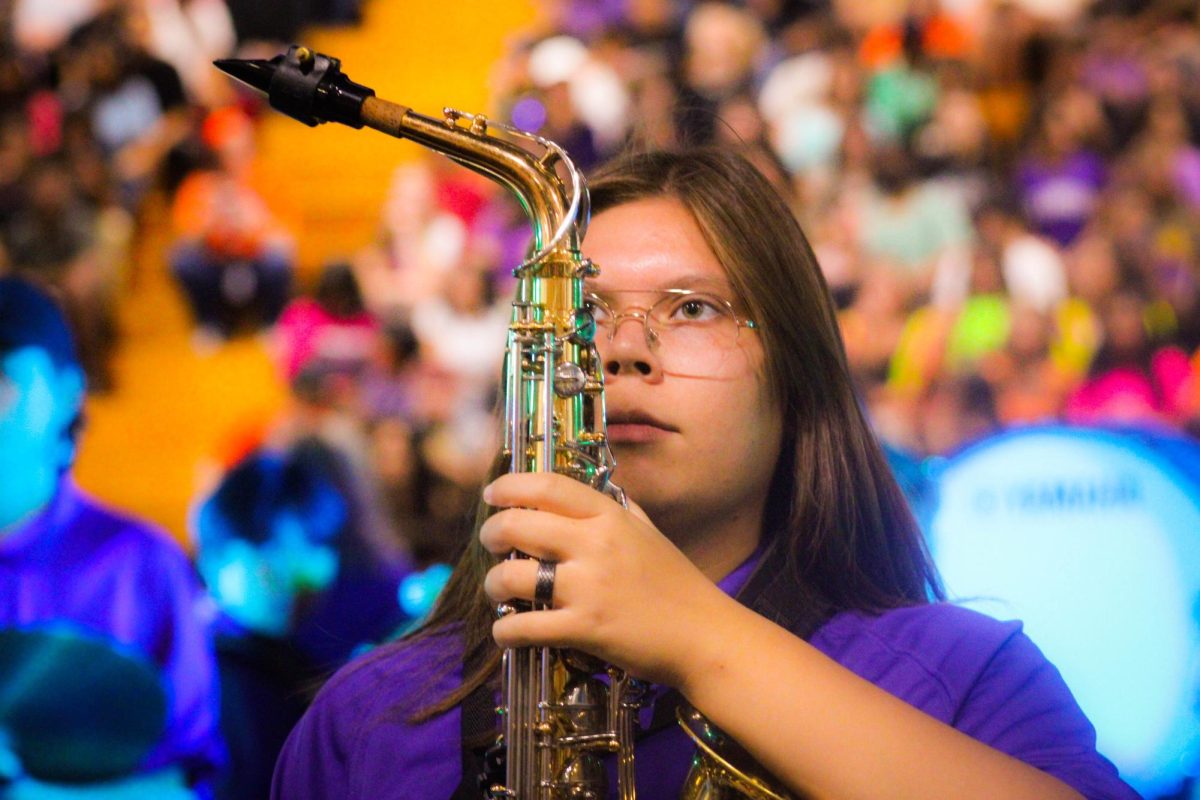 Senior and band president Megan Estrada plays the saxophone to help open up the 2023 RCHS homecoming rally.