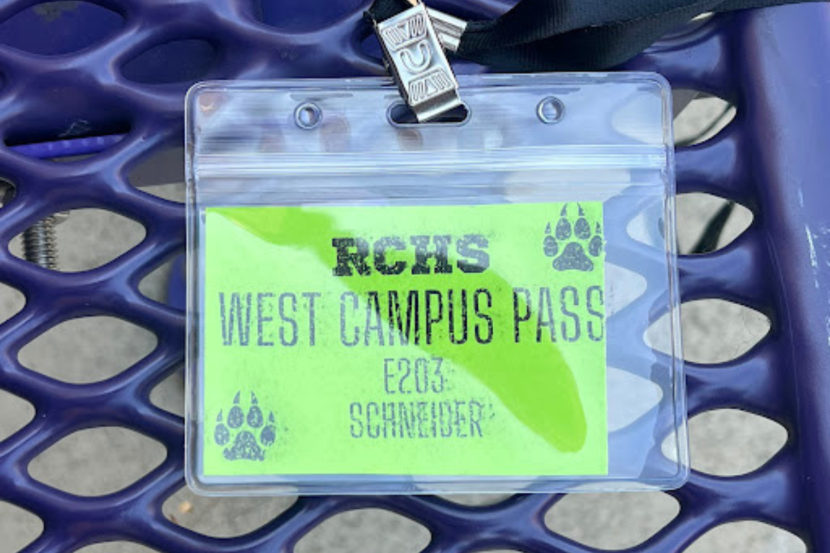 The West RCHS restroom pass is displayed on a bench. 