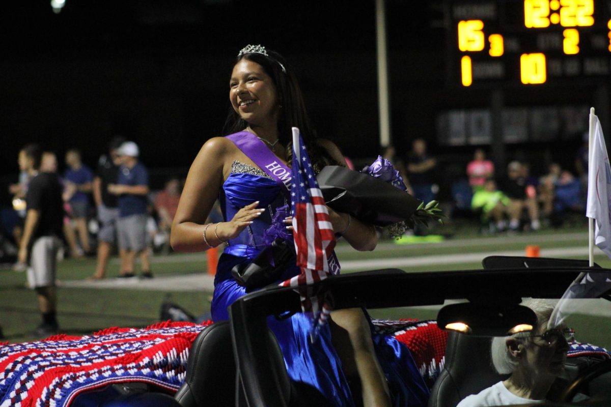Princess Kelsey Xochitiotzi charms the crowd as she awaits the 2023 Homecoming Queen's crowning.