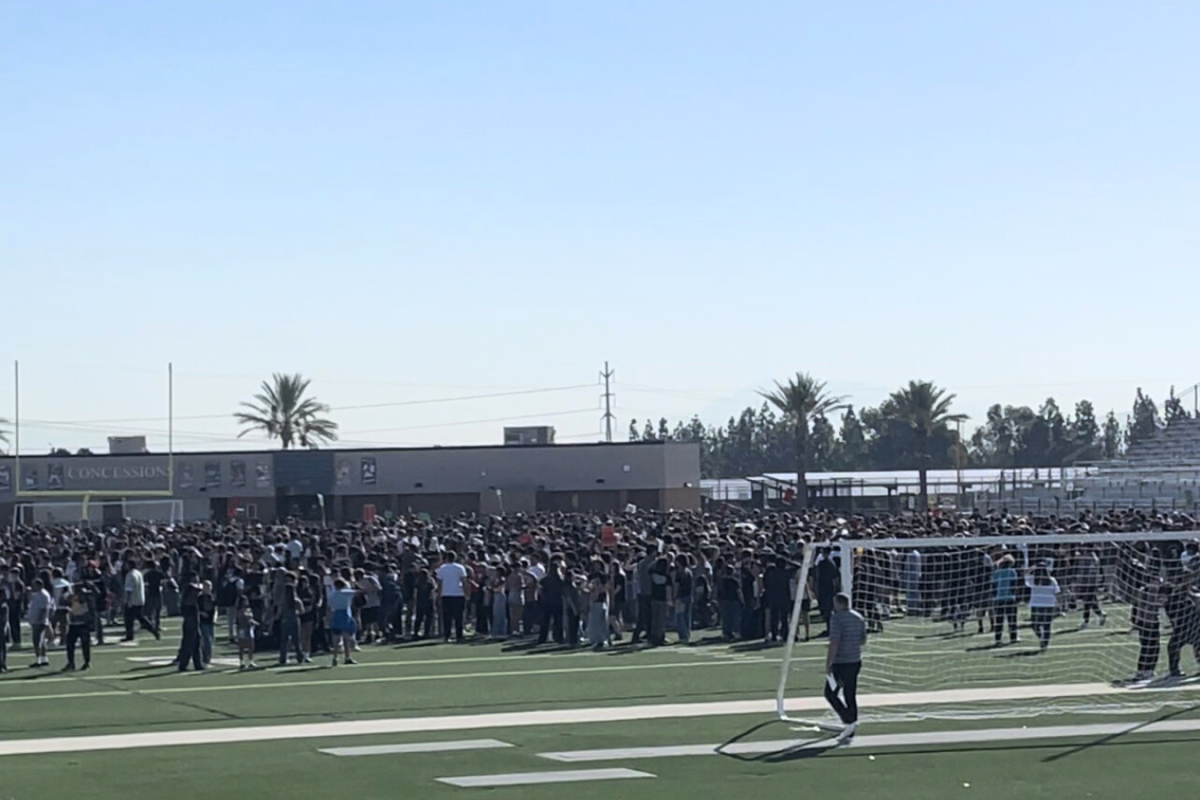 Students evacuate from the campus during the Great ShakeOut. 