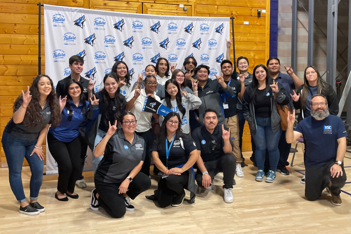 Members of the Cal State University San Bernardino pose for a picture at the RCHS Cal State Admission Day event. 