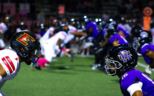 The RCHS Cougars face off against the Etiwanda Eagles defense at the annual Pink Out game on Friday, Oct. 6.