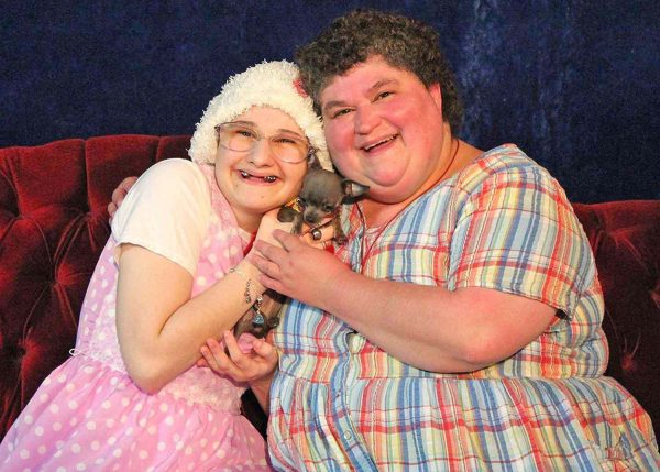 Gypsy Rose Blanchard and her mother Dee-Dee Blanchard hold a small dog. This photo was taken when Blanchard was still under the care of her mom. 