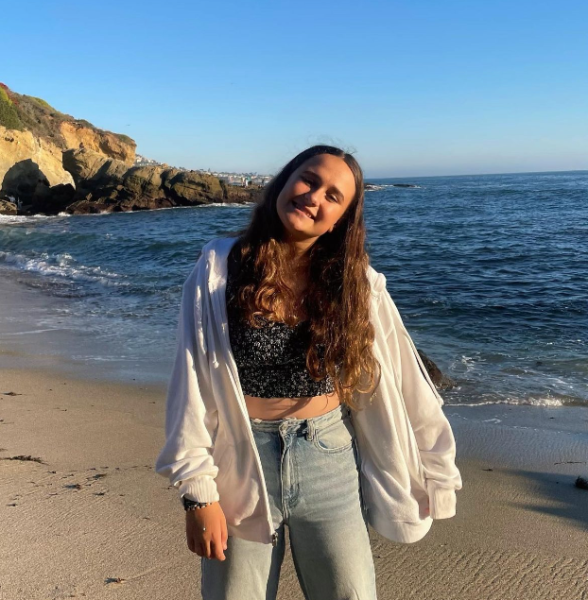 Freshman Regan Wilson poses for a picture as she enjoys her time at Laguna Beach.