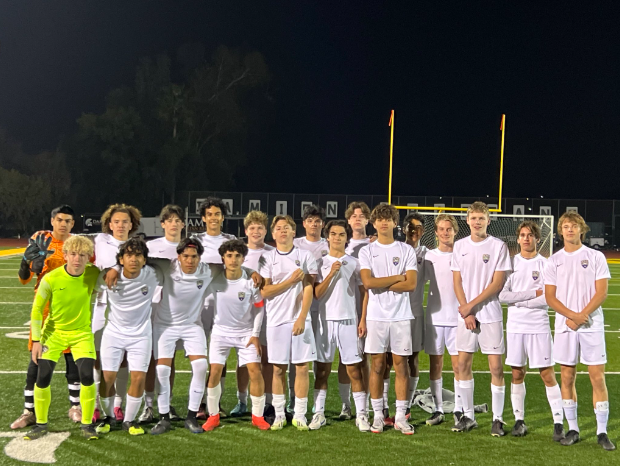 The boys varsity soccer team poses for a picture after their 6-2 win against Damien High School.
