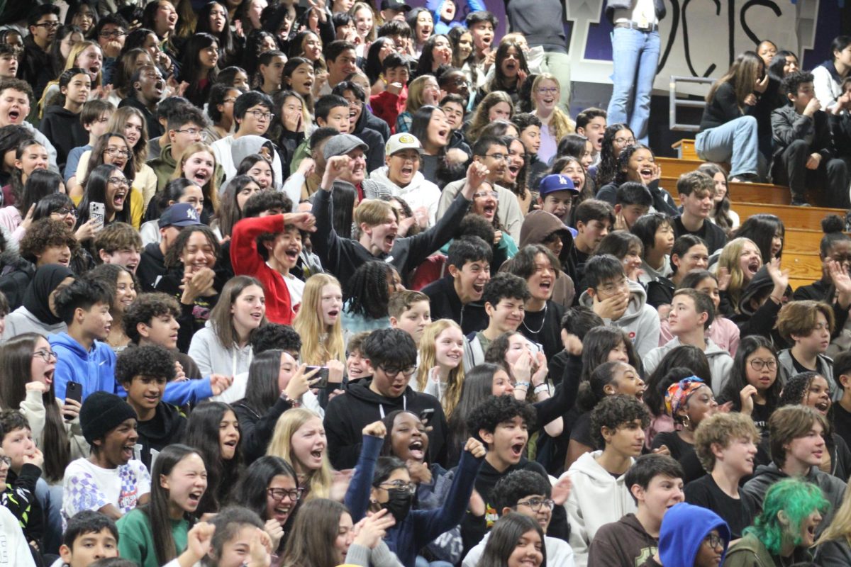 8th+graders+in+the+bleachers+from+the+surrounding+middle+schools+are+hyped+up+and+excited+to+attend+the+rally.