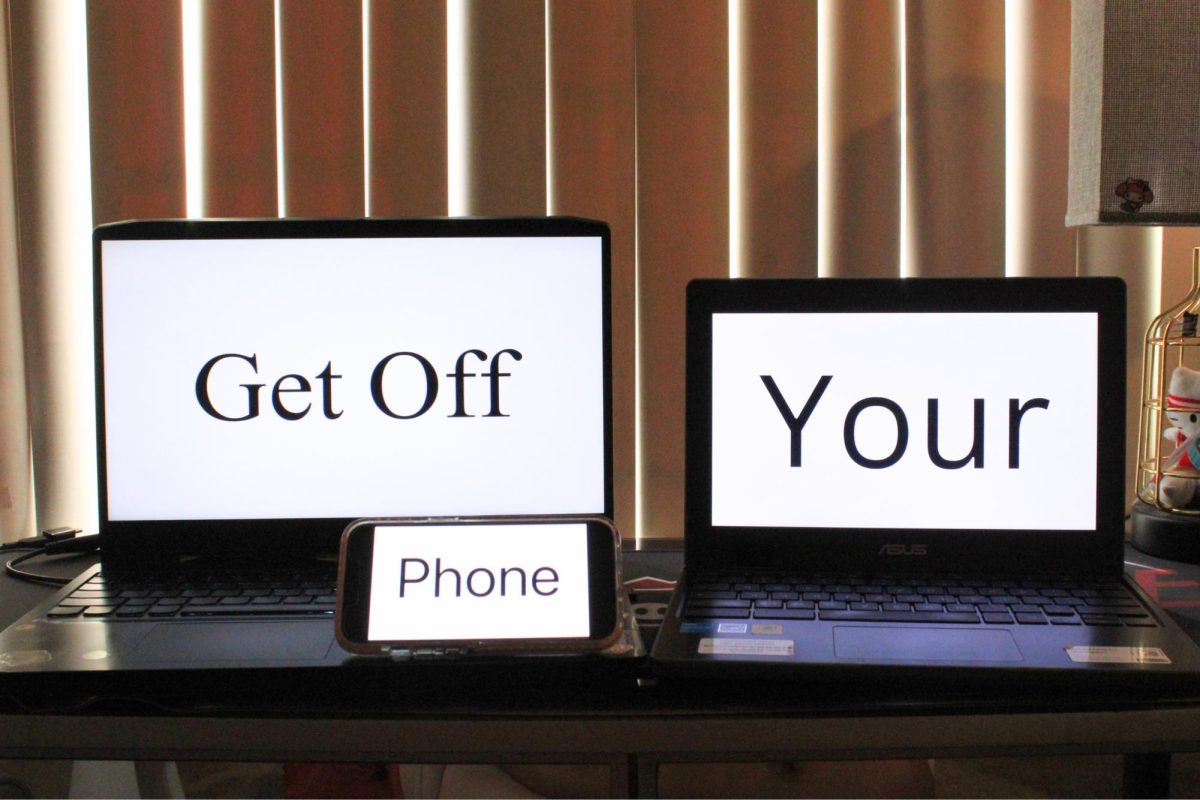 Three devices are displayed on a desk with the phrase “Get Off Your Phone” separated among the devices.