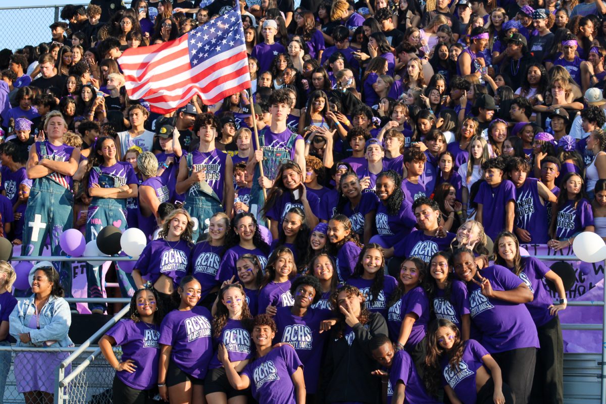 The RCHS Rooters and dance team pose for a picture.