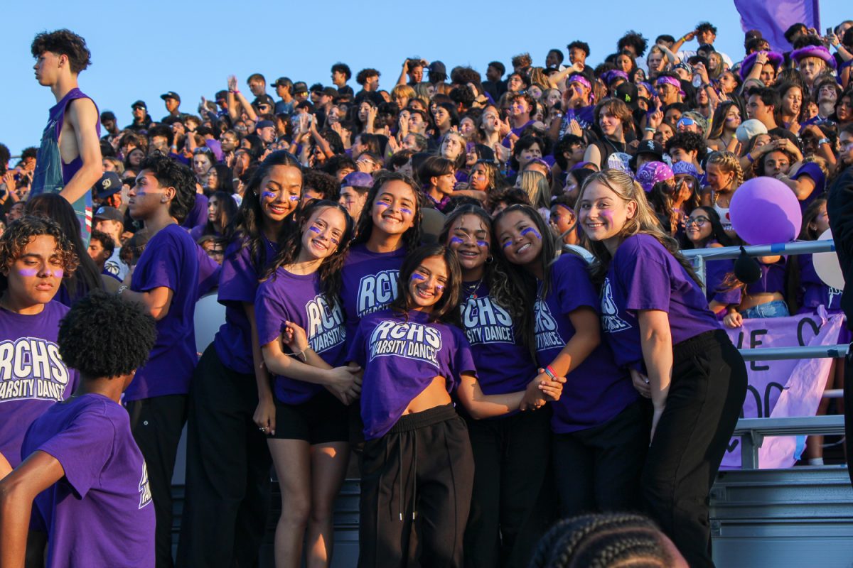 The varsity dance team poses for a picture at the first football game.