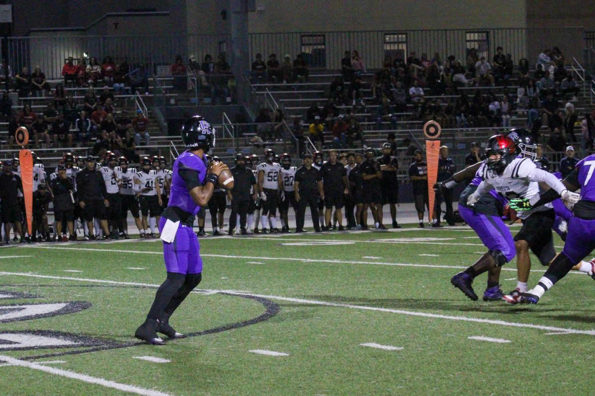 Junior quarterback Jacob Chambers prepares to throw the football.