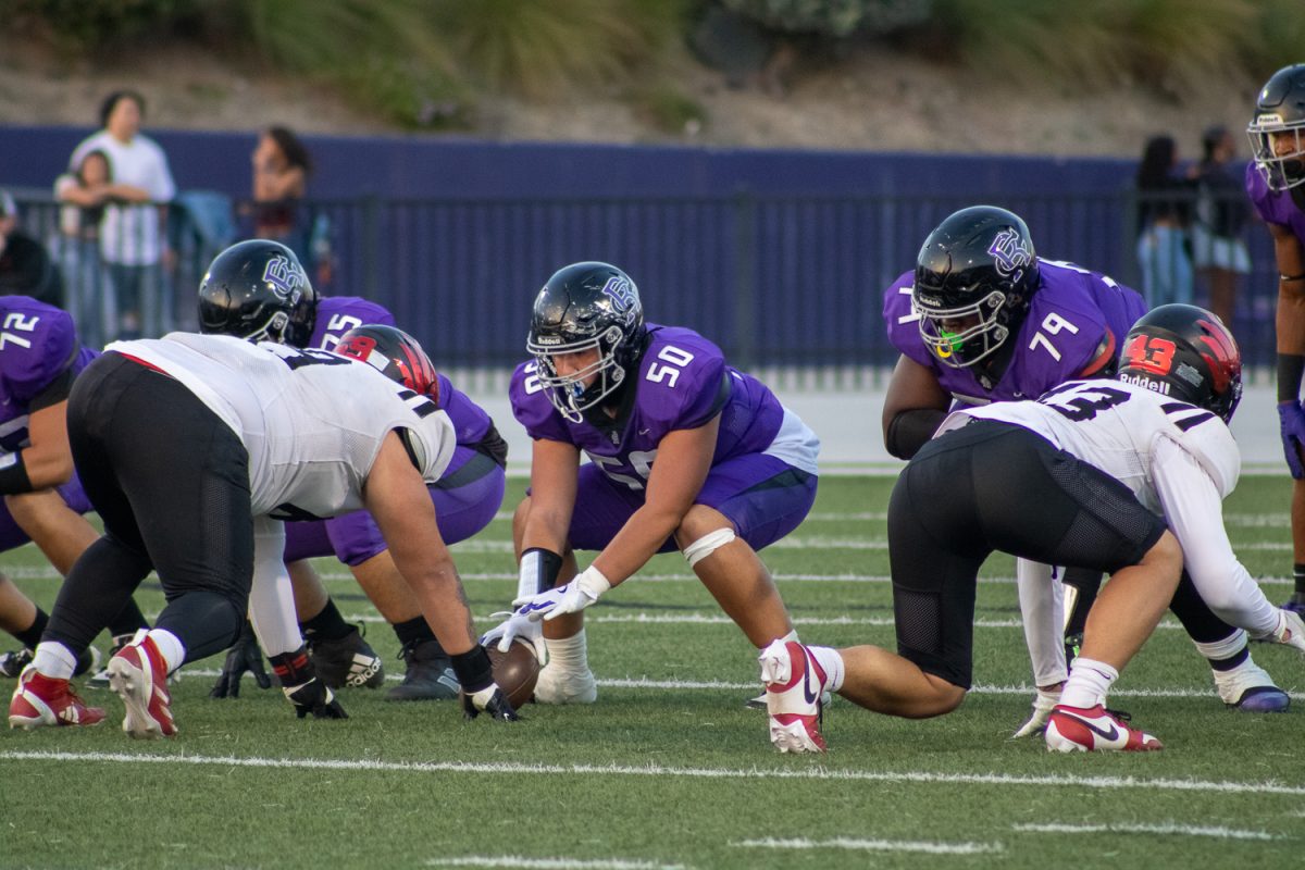 Junior Daeton Jiminez prepares to hike the ball for a new play.