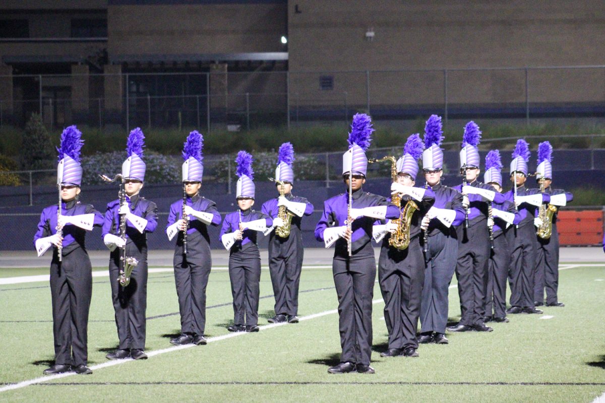 Performers hold up their instruments getting ready to play.