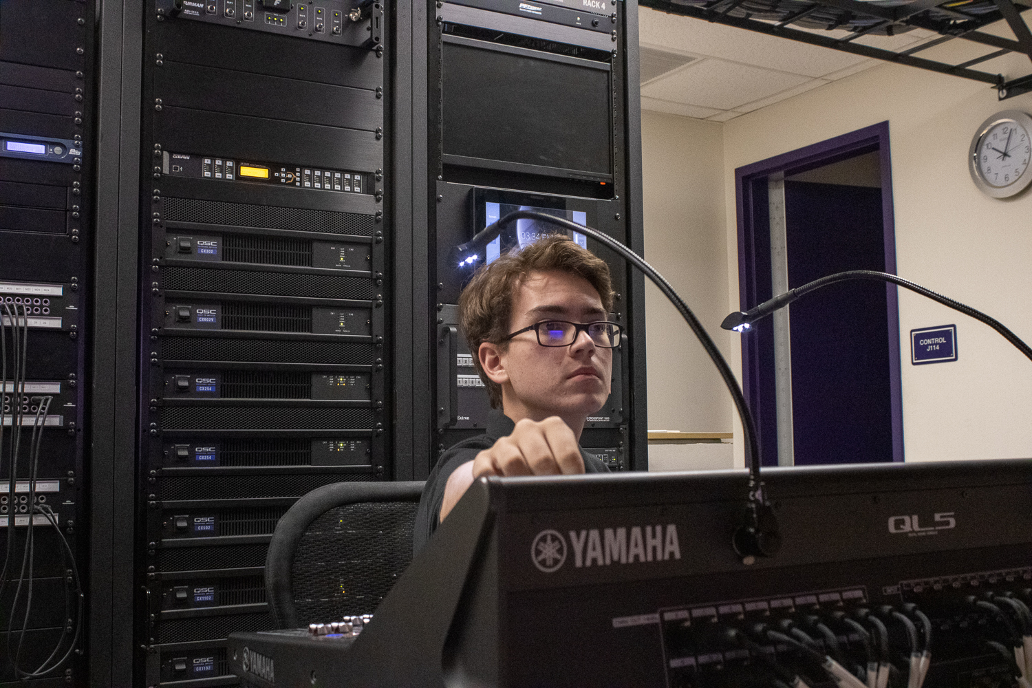 Senior Noah Schlanger works the booth to prepare for the upcoming show. 