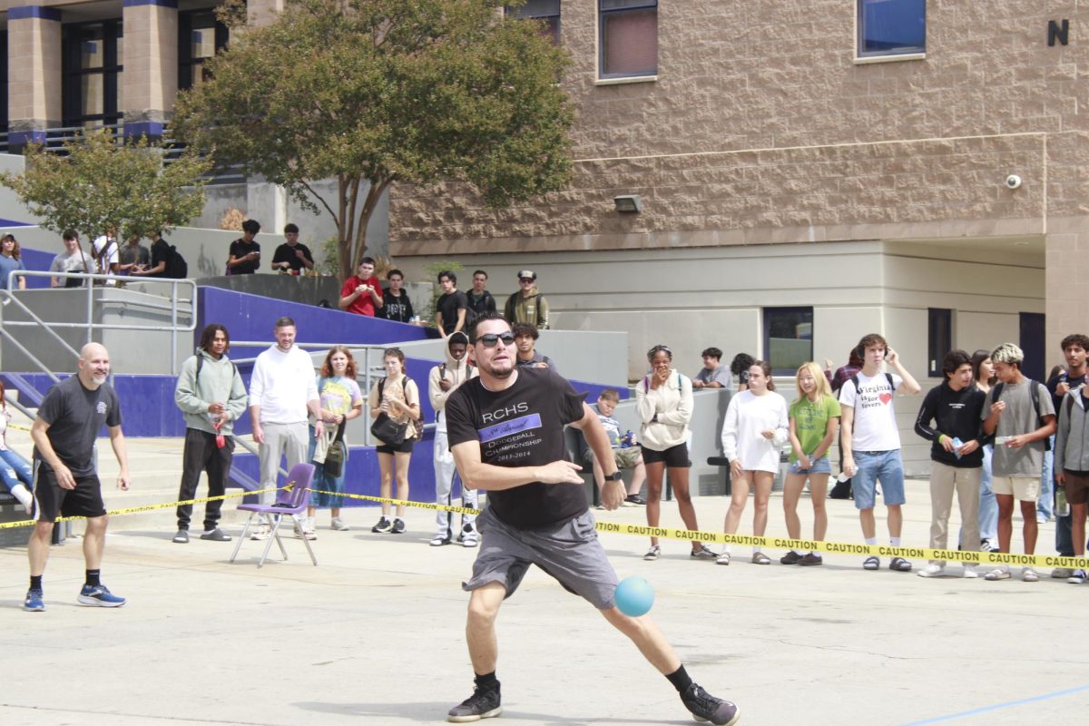 Mr. Jose Fuentes attempts to dodge a ball during the annual staff dodgeball competition. 