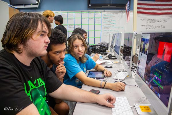 Gavin Jense, Robert Velasquez, and Jayla Rodriguez are editing the Ninja-go Intro for the bulletin. 