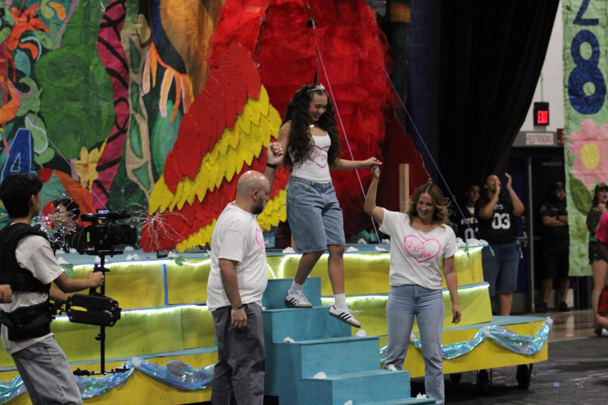 Ariana Devitta walks down the steps of a Rio themed float at this years homecoming rally.