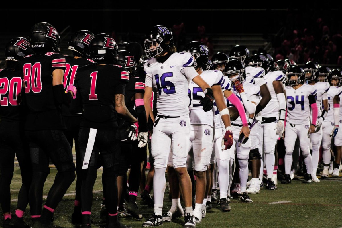 RCHS varsity football team high fives the opposing Etiwanda Eagles after winning 35-14.