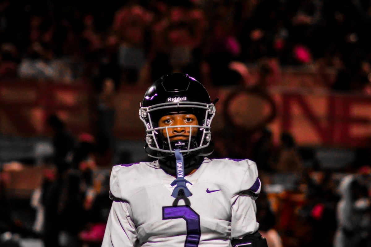 Junior quarterback Jacob Chambers walks toward the middle of the field during the game against Etiwanda.