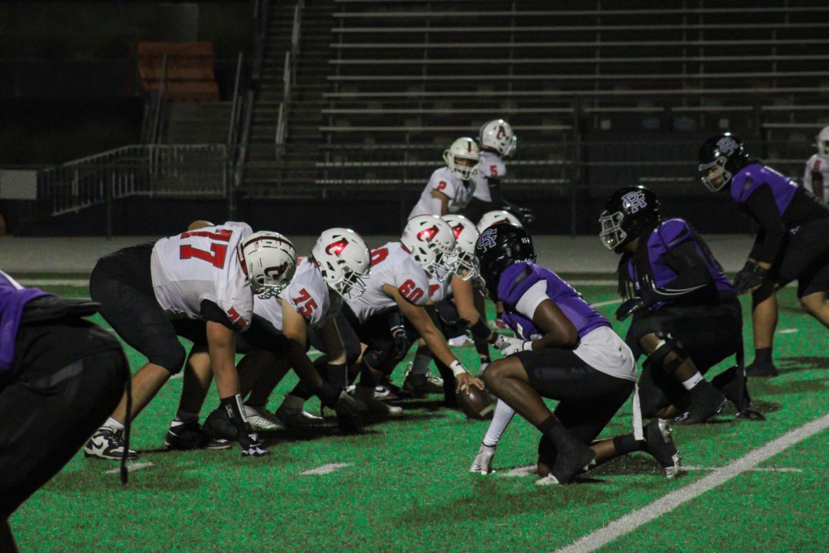 Rancho Cucamonga's defensive line  gets set against Ayala.