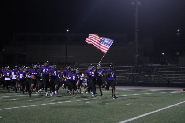 The RCHS varsity football team charges out onto the field at the Minions-themed football game. For the Friday, Oct. 11 game against Ayala. 