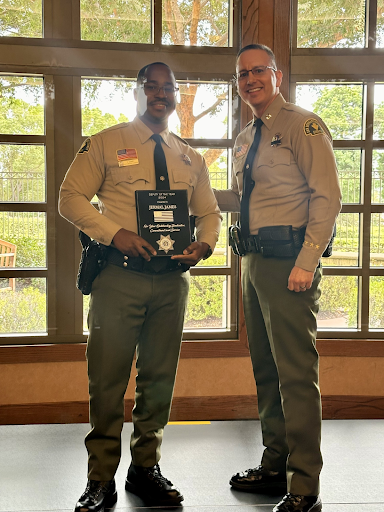 Deputy James holding his plaque that was awarded to him by the Rancho Cucamonga Police Department at the ceremony. 

Credit to the RCPD.