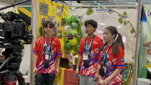 Evan Sun (left), William Wu (right), and Emily Zhang present their dones in front of the judges. 

Credit to William W.