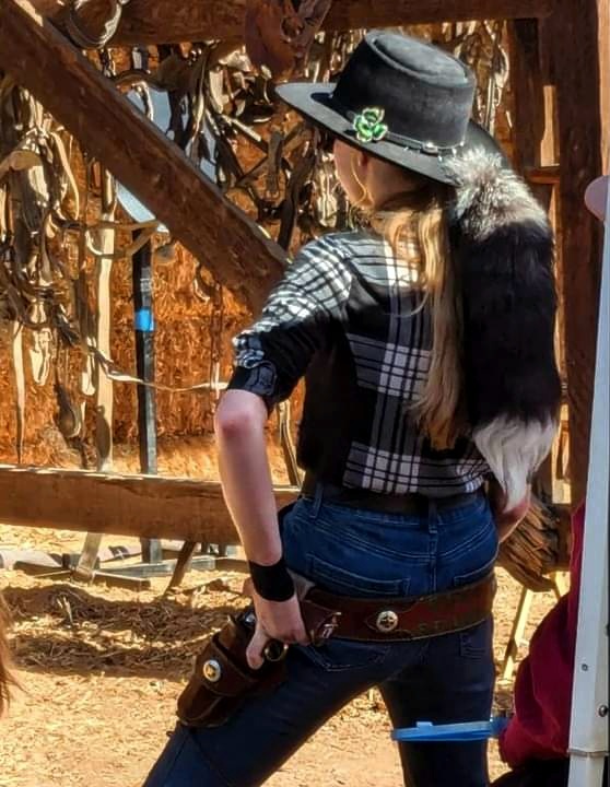 Olmsted getting ready to fire her six shooter.