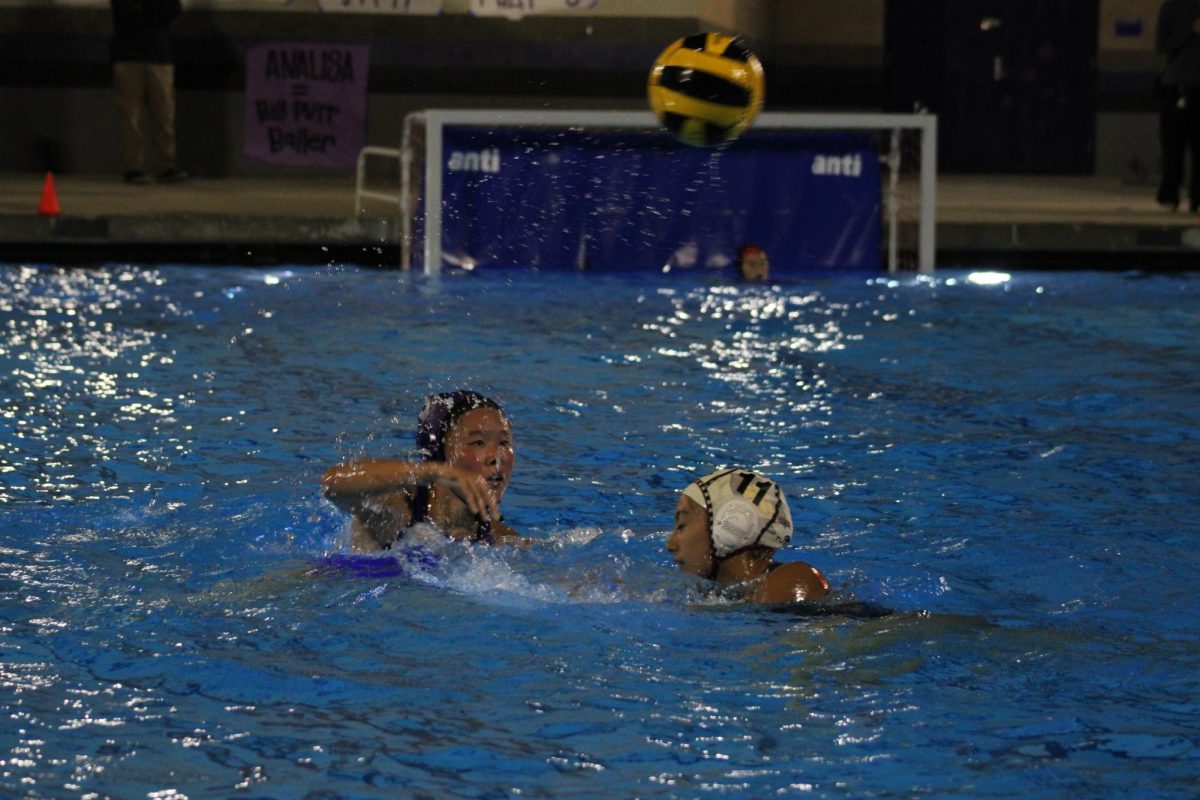 Junior Audrey Lee throws the ball to a teammate in an attempt to score a goal.
