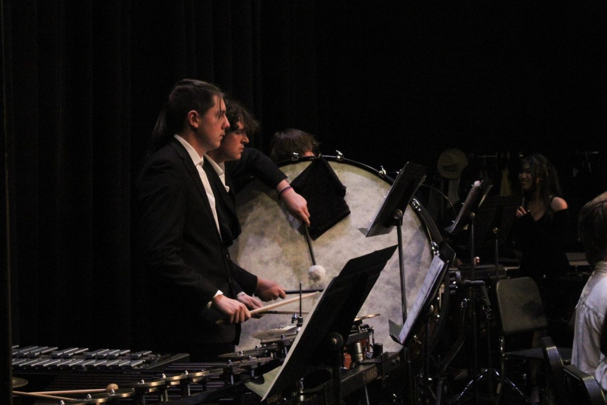 Junior Charlie Ogden and sophomore Chase Nixon play the snare and bass drums for their concert piece, "The Great Locomotive Chase" by Robert W. Smith.