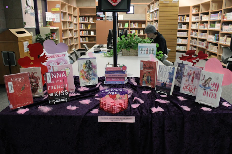 Full spread of books at the Valentine's Day stand in the RCHS library. -Caption by Jessica Simpson 