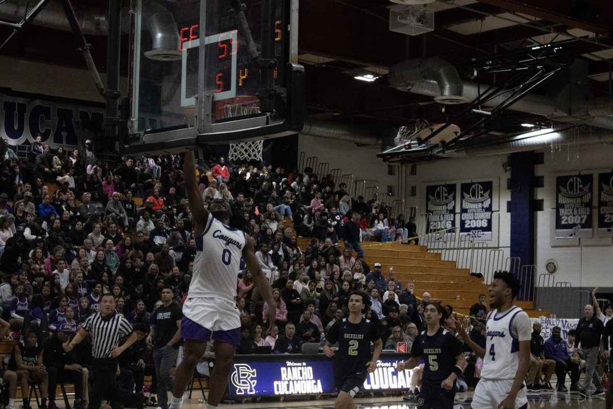 Senior Chu Chu Osuji goes for a dunk against Los Osos High School.