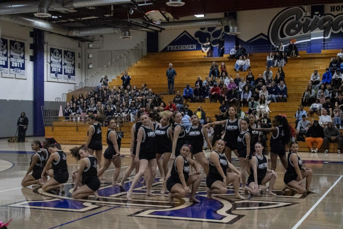 The varsity dance team performs a half time show at a game against Los Osos High School.