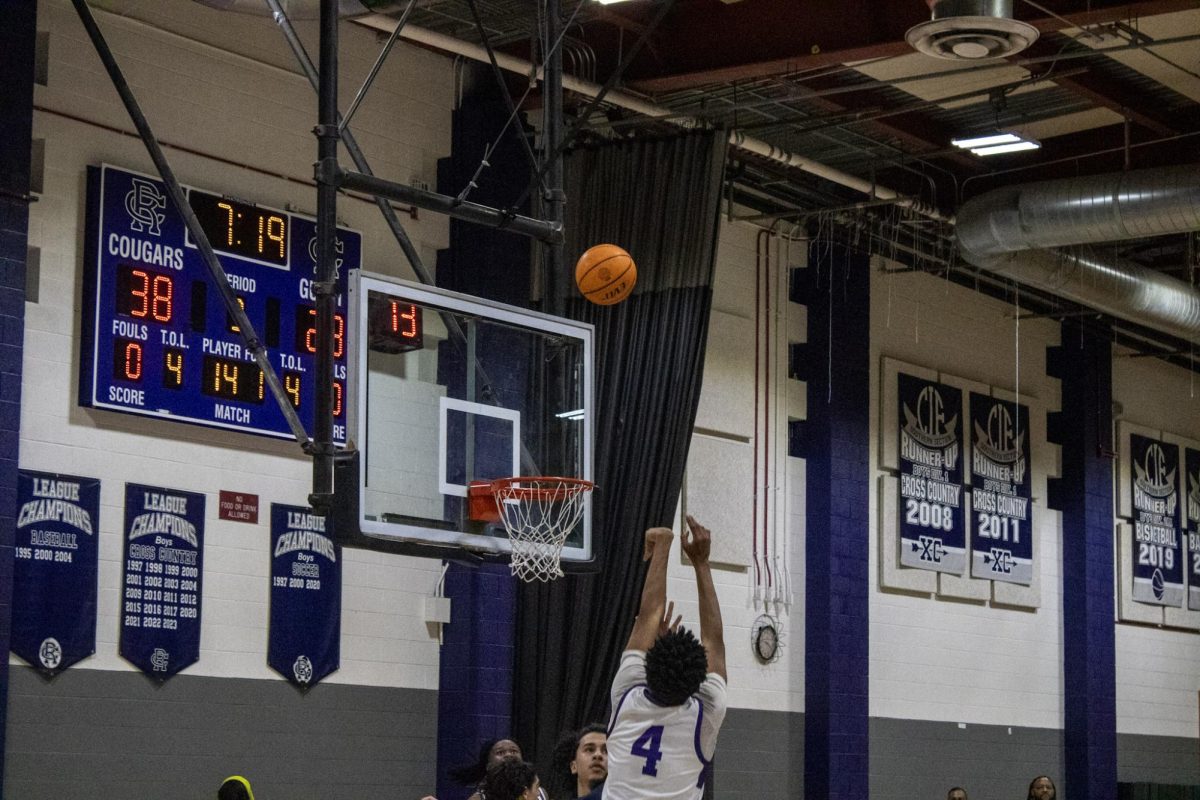 Senior Mckel Shedrik shoots a basket at a game against Los Osos.