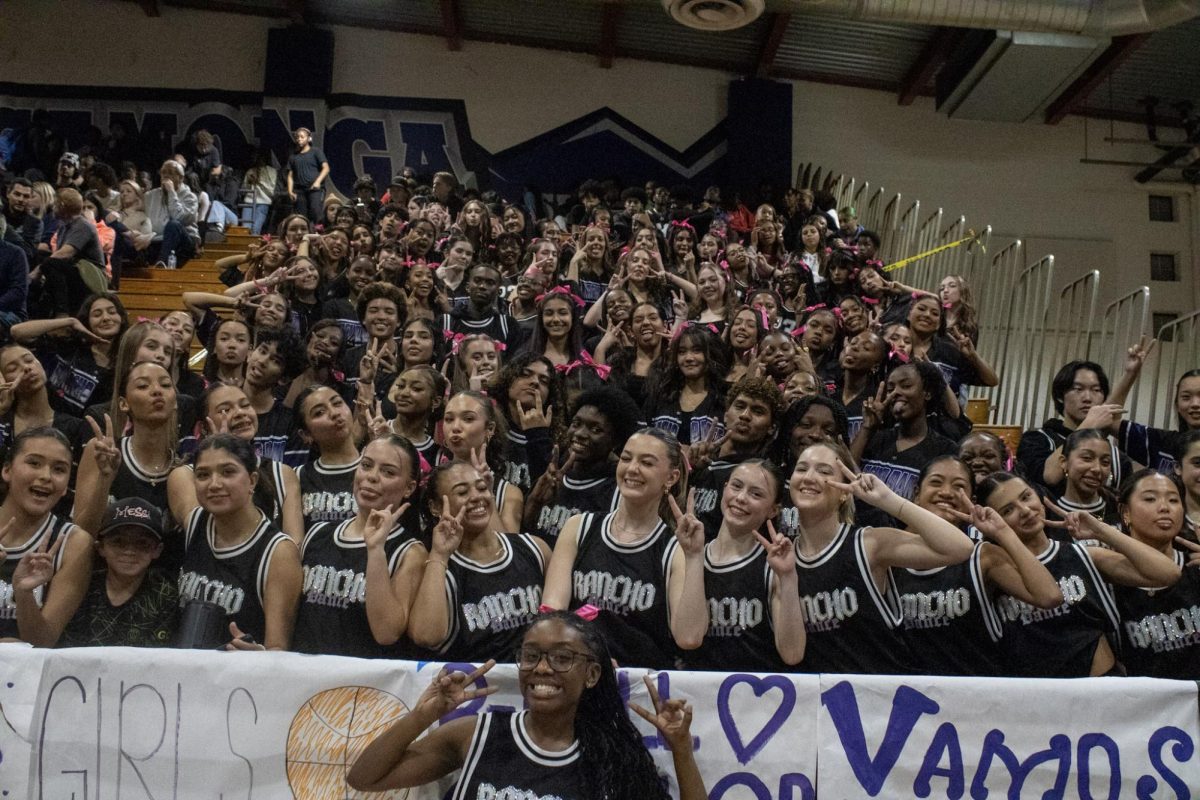 The RCHS varsity, JV, and dance three teams pose for a picture at the.varsity boys basketball game against Los Osos on Friday, Jan. 31. 