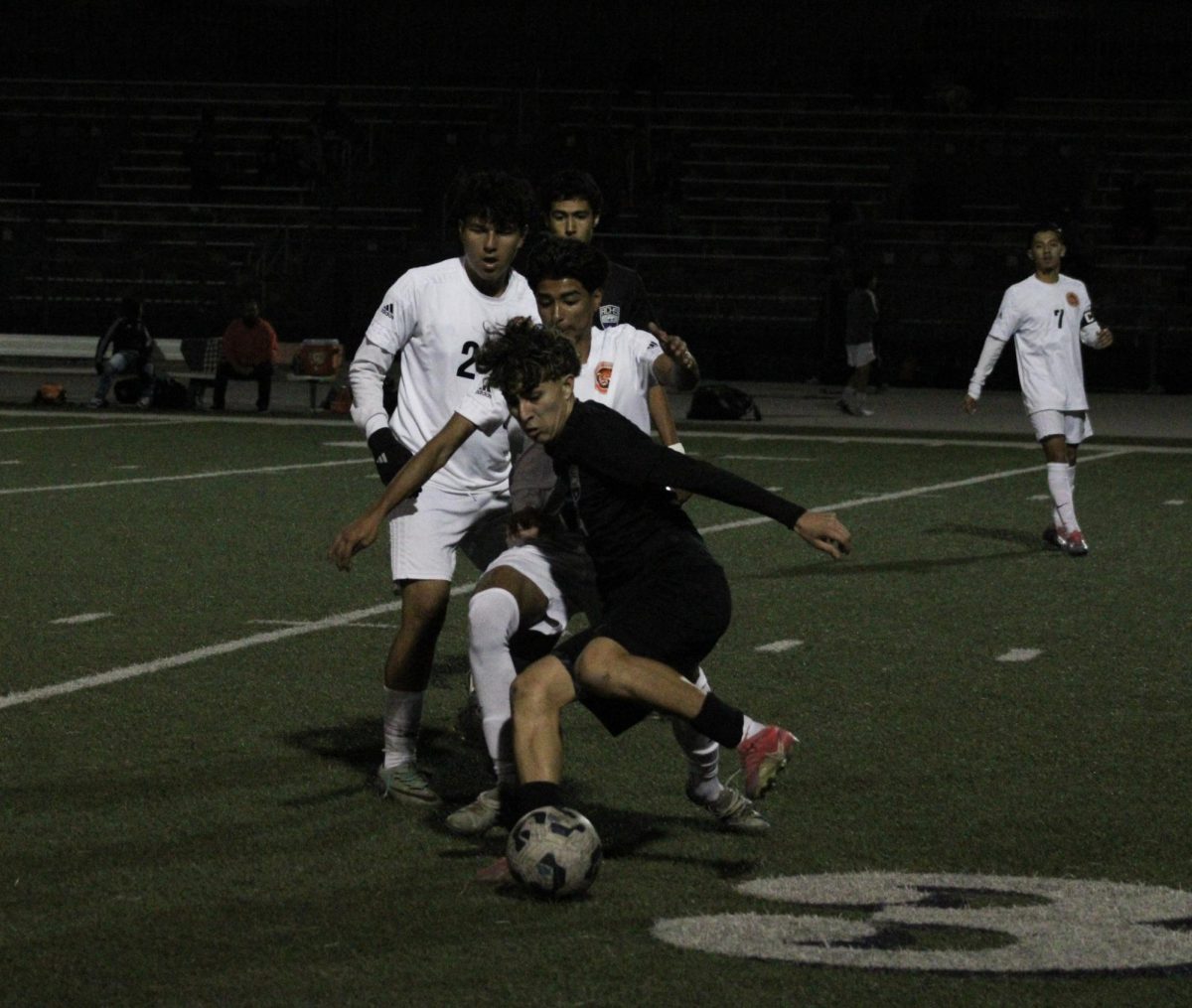 Sophomore Jacob Riestra battles to keep the ball away from the other players.