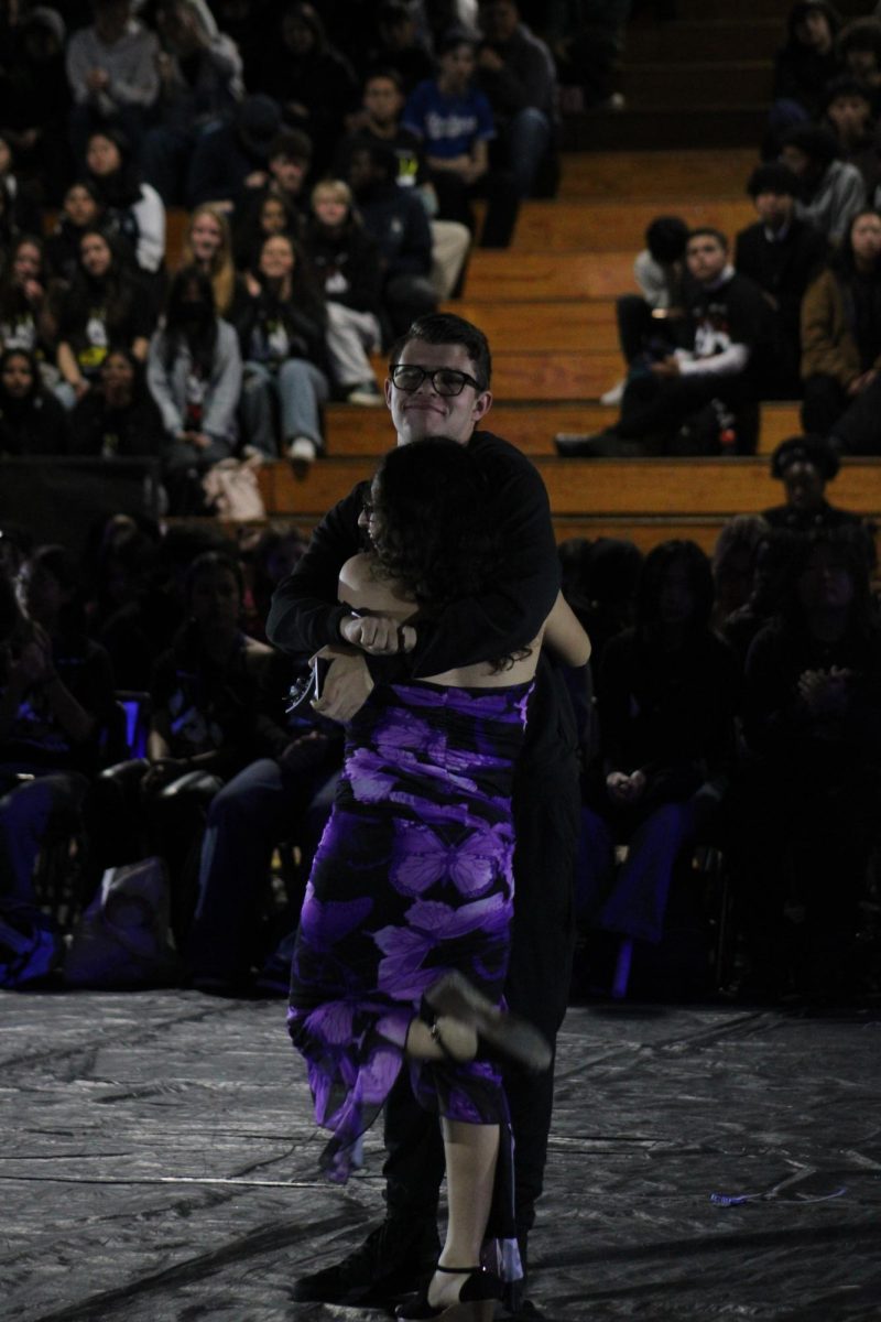 Stephanie and Evan hug after receiving the Most Inspirational award at ren rally.  