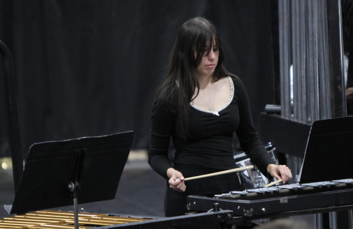 Junior Clarissa Quevedo plays bells.