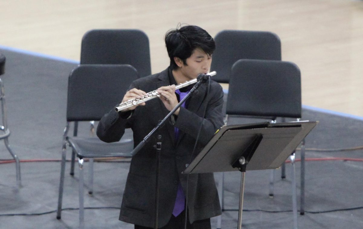 Senior Joshua Lin performs flute solo.